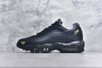 Black and Gold Athletic Sneakers Outdoor Display